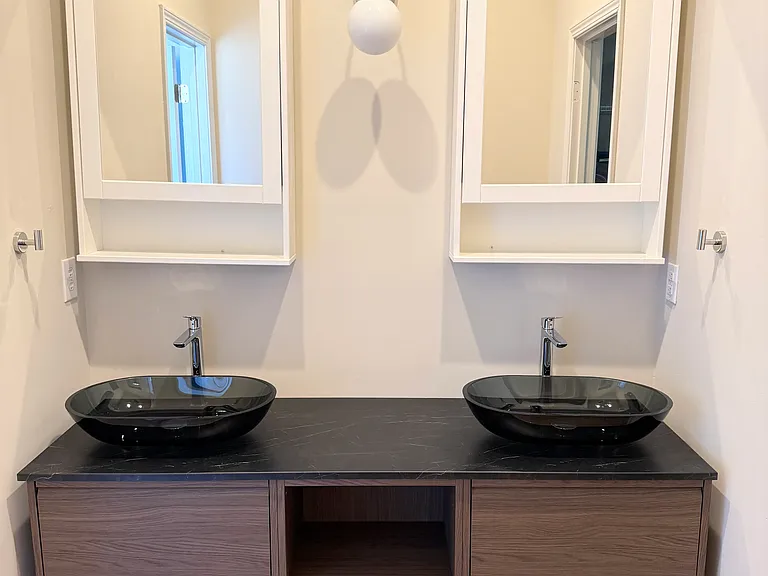 Floating vanity features Hansgrohe fixtures