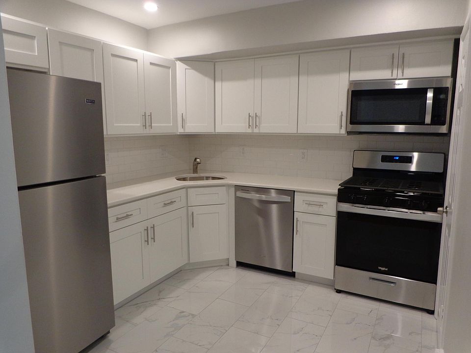 Brand New Kitchen with new stainless steel appliances and new flooring and lighting