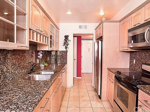 An updated cook?s kitchen with granite counter top
