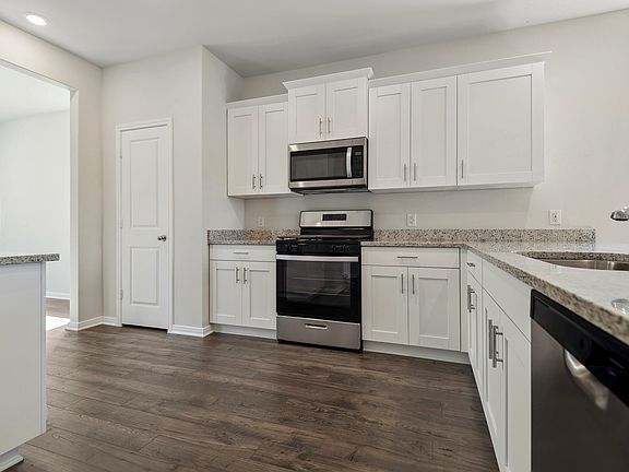 Your new kitchen includes a full suite of stainless steel appliances by Whirlpool.