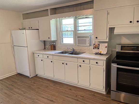 Spacious kitchen with brand new fridge.