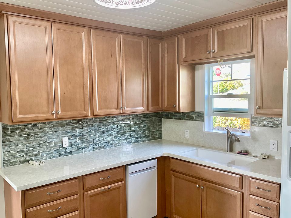 Maple cabinets, quartz countertops, subway tile backsplash lighting, appliances all new.