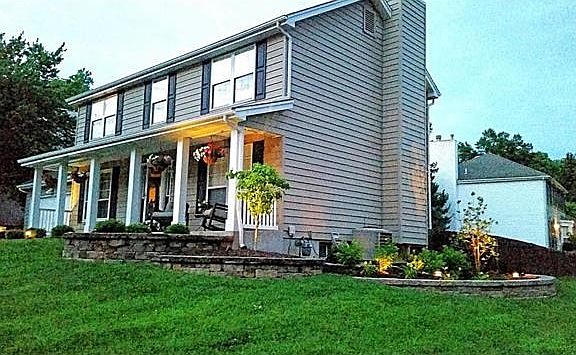 Classic architecture and pristine landscaping add great curb appeal.