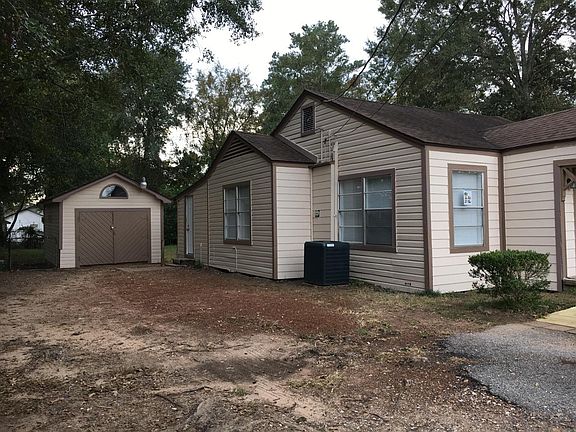 Exterior, offstreet parking, showing bonus building, idea fo
