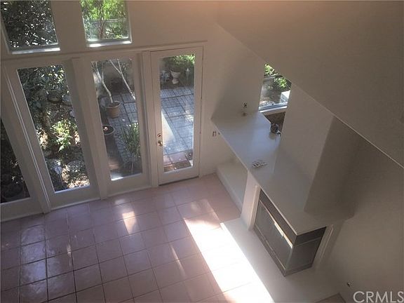 Dramatic Soaring Ceilings and Windows to let in lots of Natural Light and a Fireplace too!