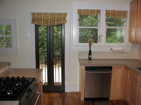 Kitchen has ample light an a charming Juliet balcony.