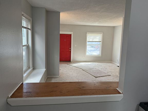 View from kitchen through dining room and living room