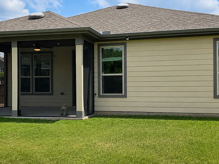 Screened porch and large backyard with plenty of outdoor space for relaxing and entertaining