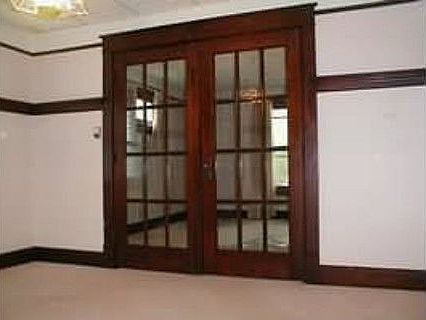french doors in dining room to living room (before paint)