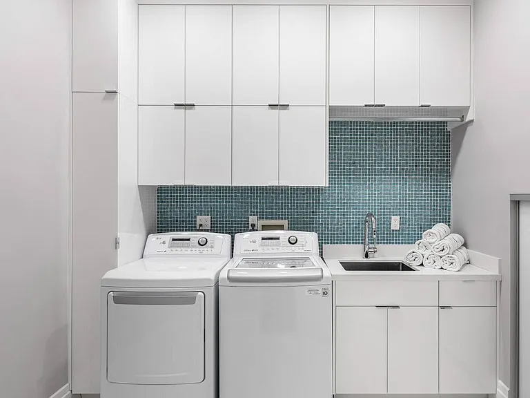 Equipped with high-efficiency washer and dryer, ample storage.