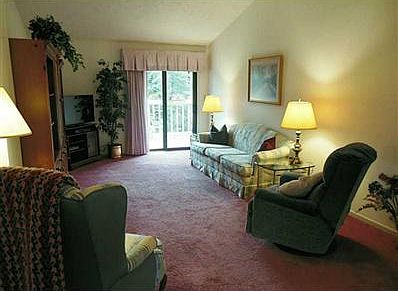 Living Room. The living room offers lots of space for entertaining and sliding doors allow plenty of light to shine in.  (except in this case where we had a cloudy day)