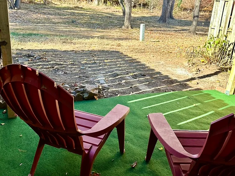 Tranquil back porch overlooking a lush, woodsy setting and open space_your own private retreat for relaxing and recharging.