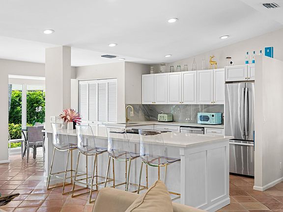 Open kitchen island design with brand new induction stove and appliances