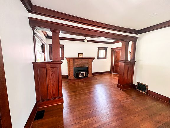 Original woodwork and wood burning fireplace insert