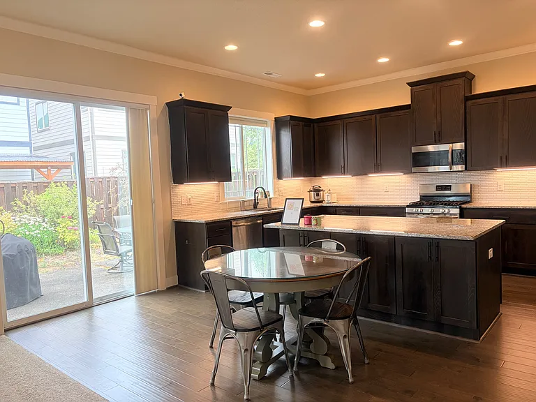 Breakfast nook off the kitchen with backyard view.