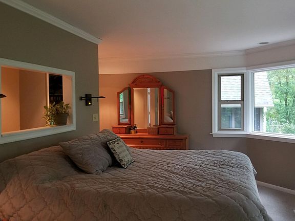 Master bedroom with balcony overlooking town