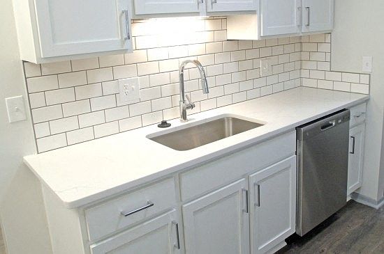 Stainless steel appliances and subway tile backsplashes to keep everything cool.
