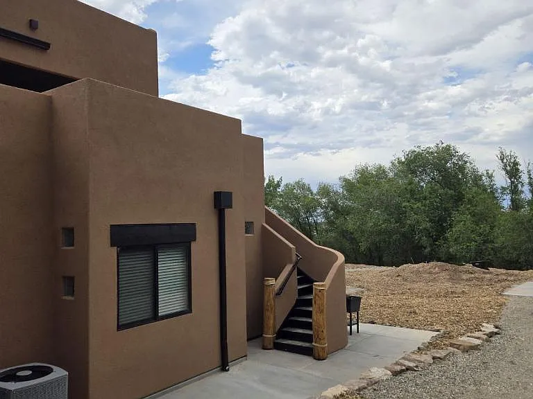 East side, stairway to 2nd level