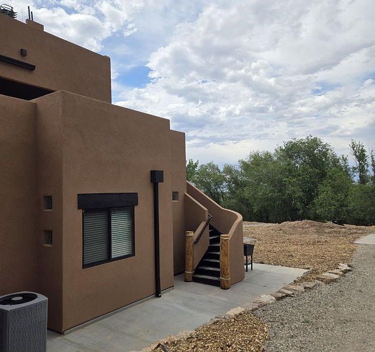 East side, stairway to 2nd level