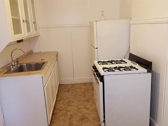kitchen has gas stove and refrigerator