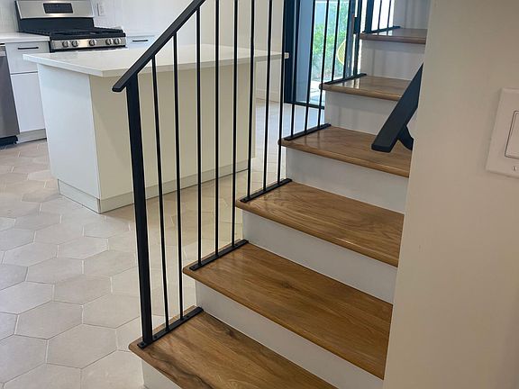 Stairs up to 2 bedrooms and full bath