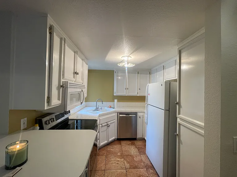 clean and cozy kitchen with plenty of cabinet and storage space, samsung over, bosch dishwasher, updated faucet