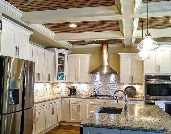 Stainless steel appliances, a gas stove and a pantry.