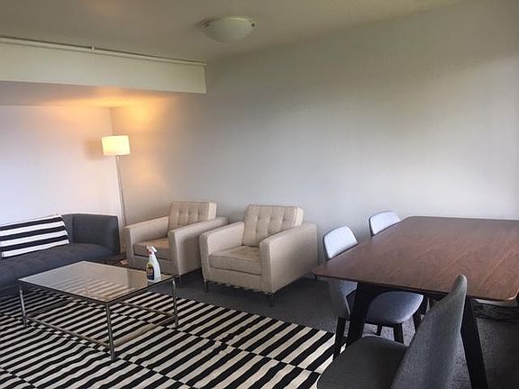 Relax in your new living room. Dining room table overlooking the lake