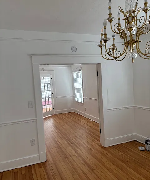 Charming interior with hardwood floors, crystal door knobs and inviting french doors