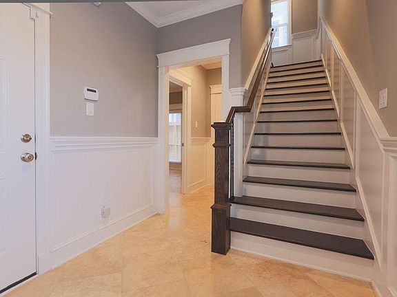 Stairway on 1st foor leading up to 2nd floor.