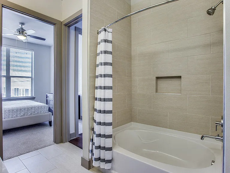 Ceramic tile surround soaking tub and walk-in showers in select apartment homes
