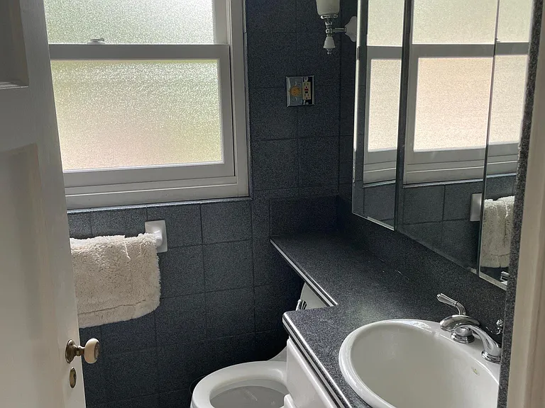 Full bathroom - storage behind mirrors