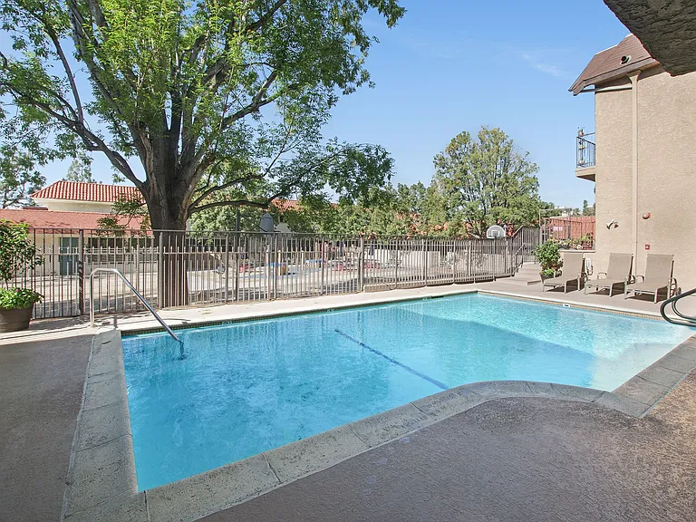 Shimmering blue swimming pool and sundeck