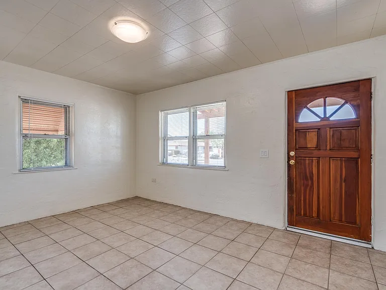 Living room with double pane windows to front of the house and side of the house.
