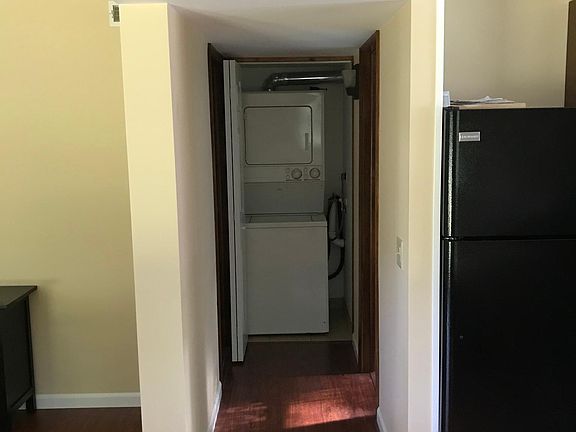 Hallway to laundry, bathroom, and bedroom