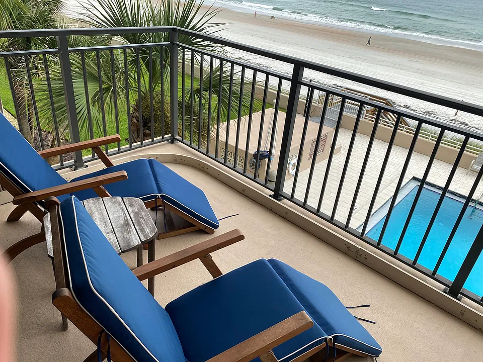 Oceanfront 22' balcony with pool view.