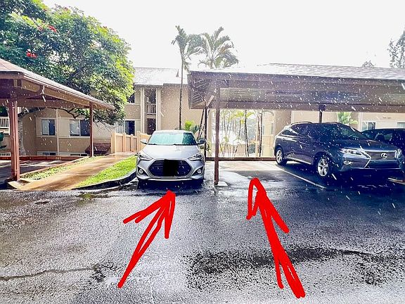 Two parking stalls right near walkway to condo