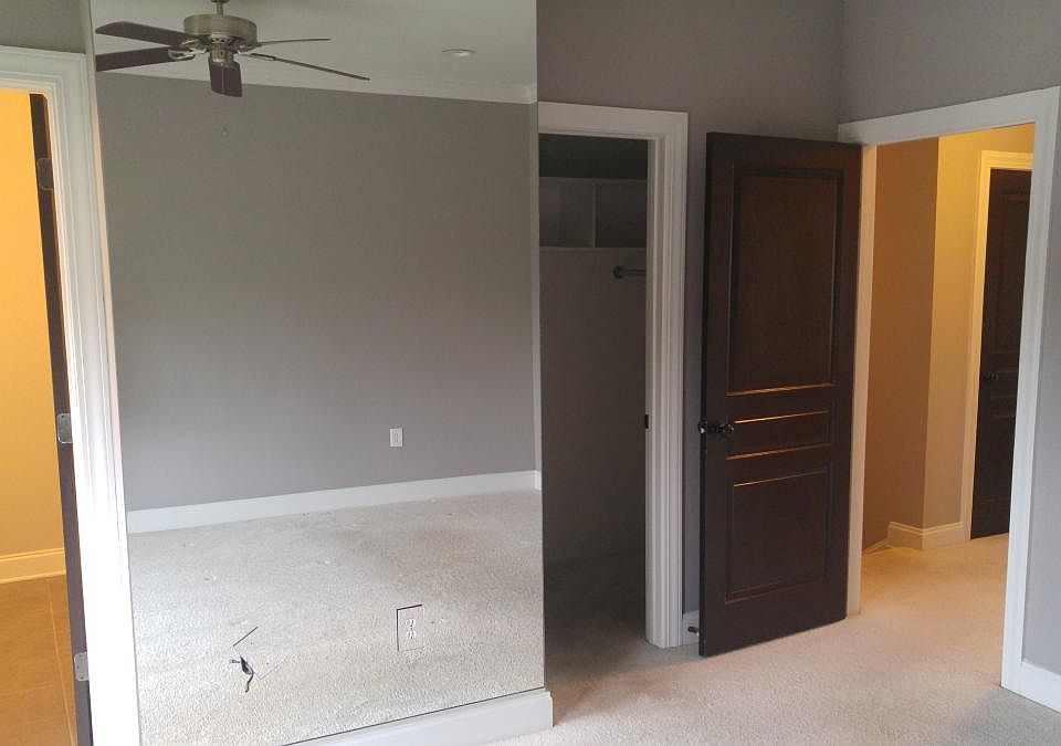 Master bedroom w/mirrored wall & bath