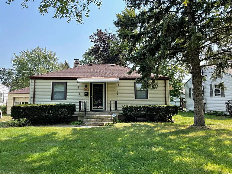 2 bedroom house with hardwood floors, new kitchen and bathroom, fenced in back yard, detached 1car garage, patio area in back yard