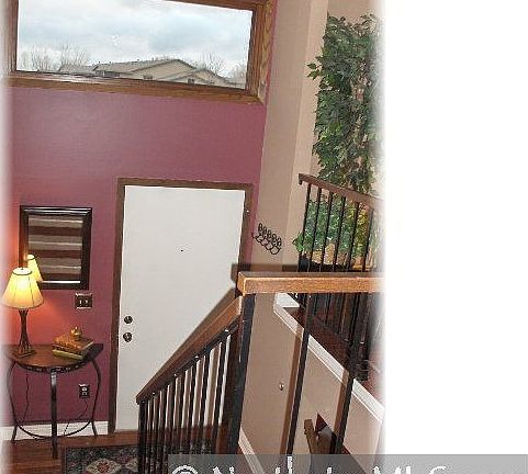 Bright foyer with open banaster