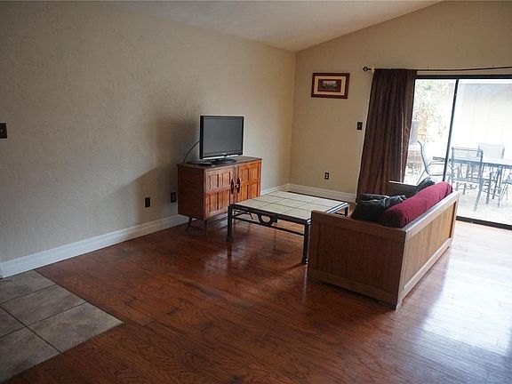 Living/Great Room is 19x13 with wood plank flooring. Note the vaulted ceiling.