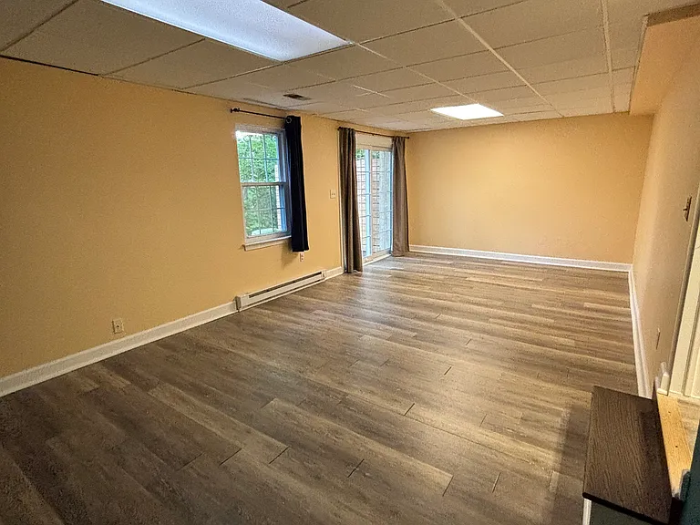 walkout basement with sliding glass doors and a window (4th bedroom)