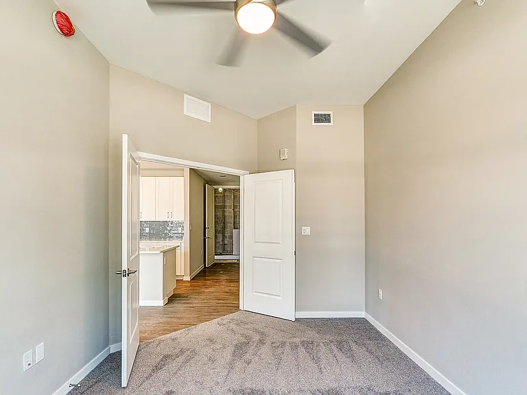 Imperial Crossing Luxury Apartment Homes unit showing a bedroom off the kitchen area.