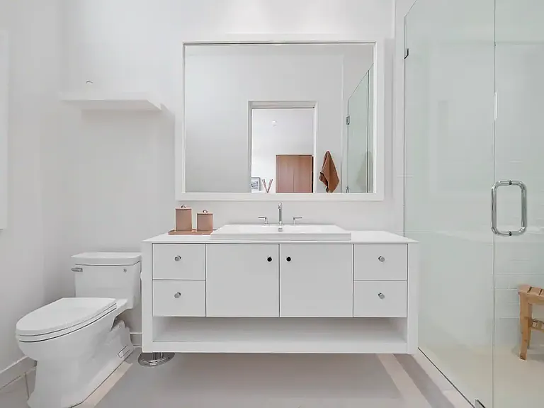 Guest bathroom features modern amenities and stylish finishes.
