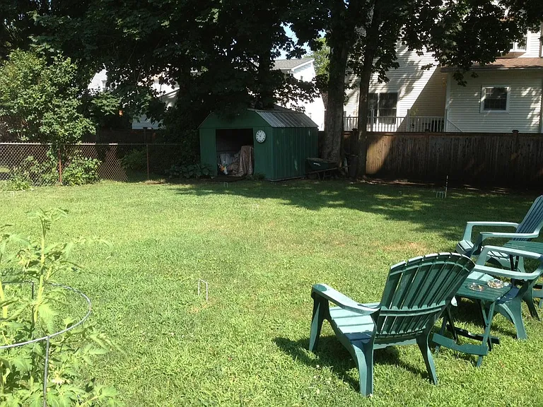 Flat back yard with grill