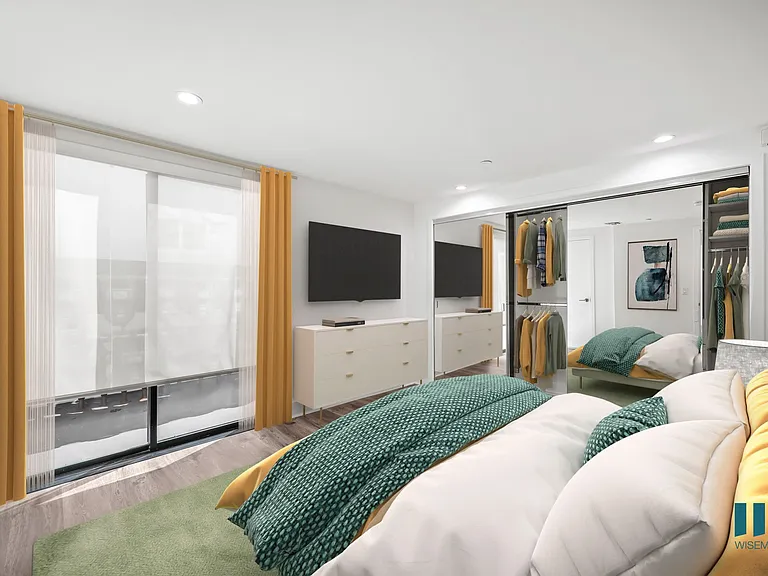 Primary Bedroom with Mirrored Closet, Recessed Lighting, and Vinyl Flooring - Two-Bedroom Two-Bathroom - Unit 108