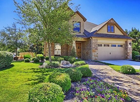 professionally landscaped front yard