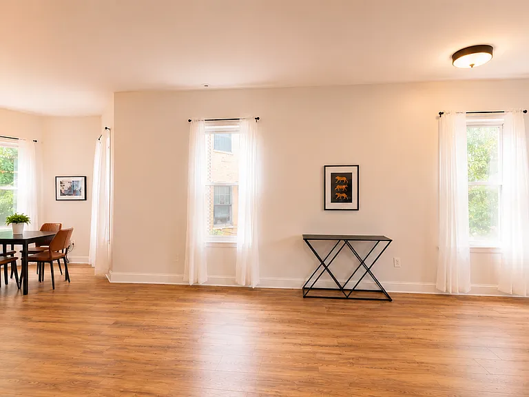 Foyer leading to the dining room and kitchen. Half bath is off to the side.