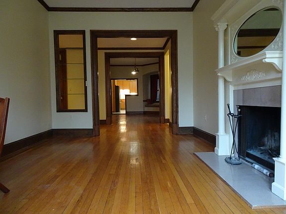 View from living room to foyer to dining room into kitchen.