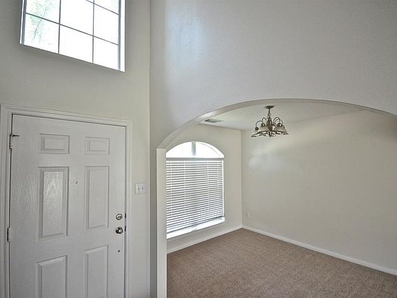 AS YOU ENTER THE HOME, FORMAL DINING ROOM IS ON THE LEFT. BEAUTIFUL WINDOW PROVIDES NATURAL SUNLIGHT.